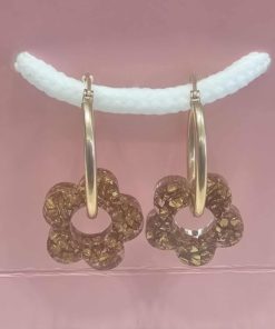 Boucle d oreille anneau doré et fleur en résine doré